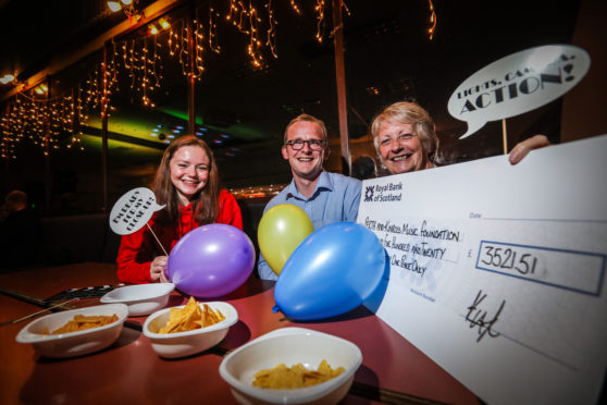 Picture shows Ola Stanton of Perth Youth Orchestra, Jonathan Cammidge, PCOG Treasurer and Mhairi MacKinnon from Perth and Kinross Music Foundation, at the party. Picture credit -  Mhairi Edwards.