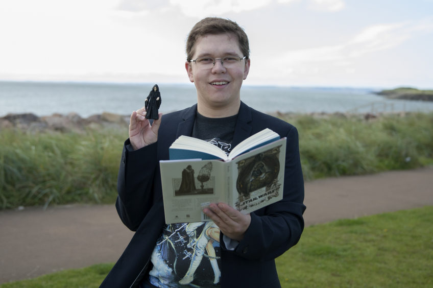 Hunor Deak with Star Wars book and Palpatine figure.