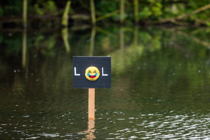 The Keptie Pond statue in Arbroath ponds was replaced with a laughing emoji sign.