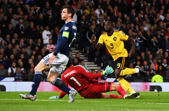 Romelu Lukaku scores against Scotland.