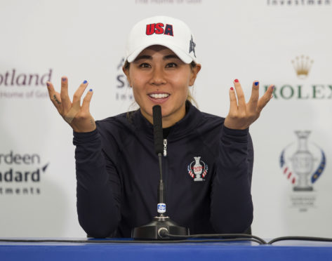 Danielle Kang demonstrates how she'll gesture to the Gleneagles crowd to bring the noise at this week's Solheim Cup.