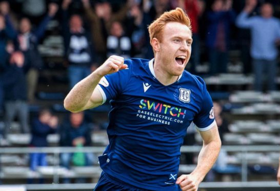 Danny Johnson celebrates opening the scoring.