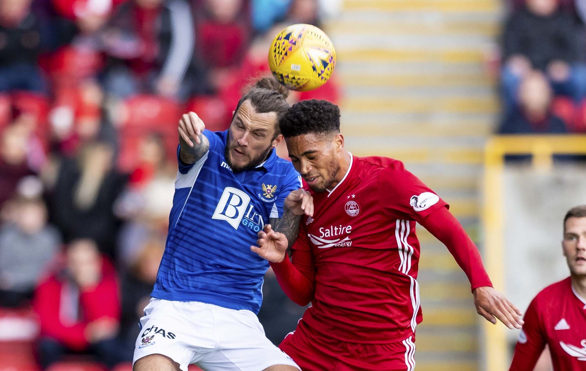 Stevie May battles for the ball with Abrdeen player Zak Vyner.