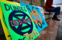 Banners and flags from a climate change protest in Dundee in September 2019.