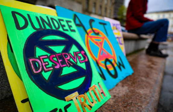 Banners and flags from a climate change protest in Dundee in September 2019.