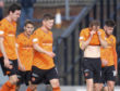 Dejected Dundee United players at full-time.