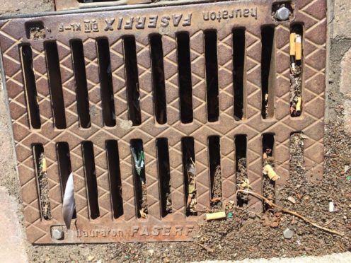 Cigarette butts blocking drains in Carnoustie.