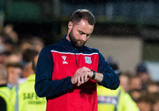 James McPake's Dundee still face a long wait for their return to action.