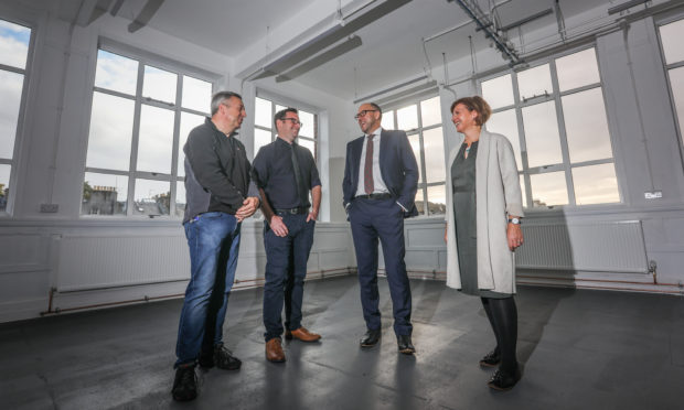 Angus Forbes, Convener of the Environment and Infrastructure Committee, Alan Farnington, Wasps Project Officer, David Littlejohn from Perth and Kinross Council and Audrey Carlin, Chief Executive of Wasps admire one of the studios which used to be a classroom.