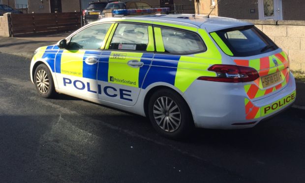 Police in Balunie Crescent.