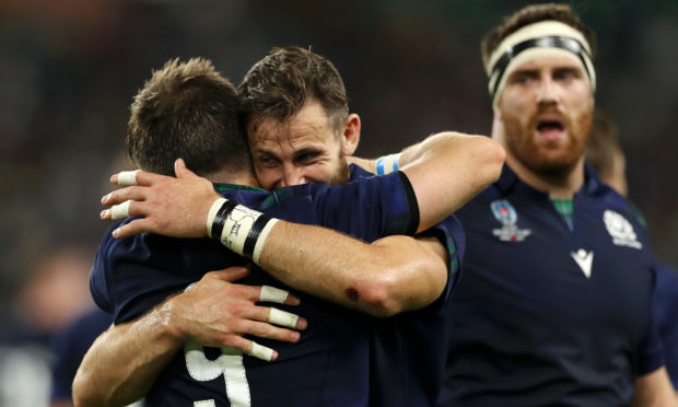 George Horne of Scotland celebrates scoring his team's seventh try with Tommy Seymour of Scotland during the Rugby World Cup 2019 Group A game between Scotland and Russia.