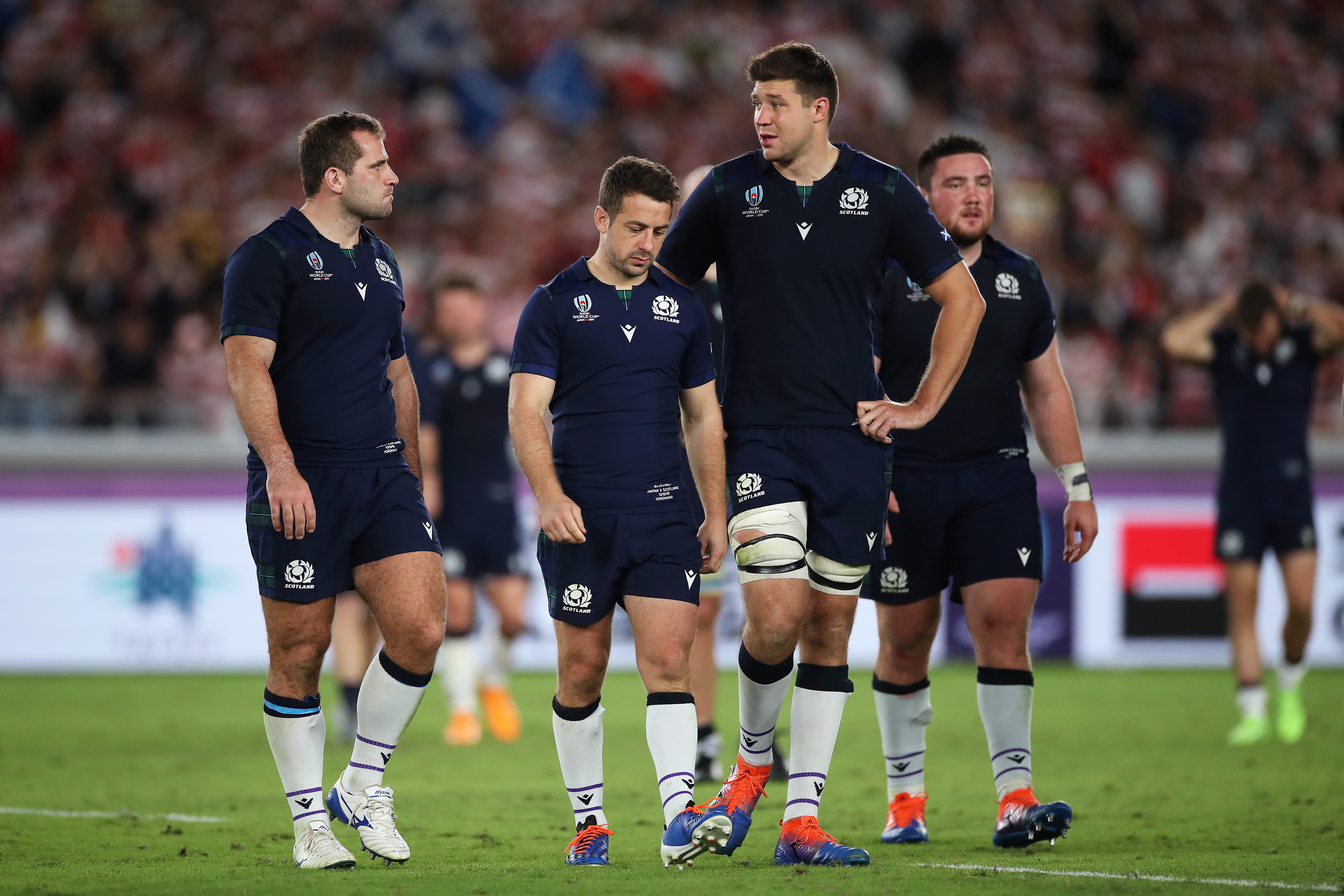 Greig Laidlaw (centre) is consoled by team mates at the end of Scotland's loss to Japan.