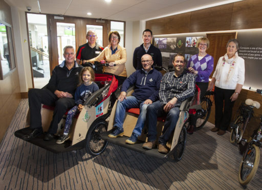 From left, front: Councillor Brian Boyd, Rosalie Wells, 7, Councillor David Cheape, David Mackland (R&A Legacy). Back: Andrew Ireland (Cycling Without Age Scotland), Pat Sawers (chairwoman of Carnoustie Golf Links), Michael Wells (chief executive of Carnoustie Golf Links), Lorraine Young and Jean Brown, both of the Carnoustie chapter of Cycling Without Age.