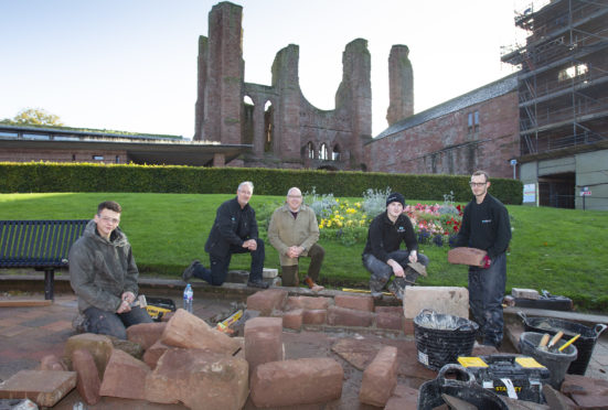 James Robertson.(2nd from left).. Historic Environment Scotland's Works Manager alongside 
Ian Ballantyne(3rd from left) past Dean of Arbroath Guildry. also pictured are Historic Enviroment Scotland apprentices L to R:
Liam Macaulay, Luke Maher, Douglas Stevens