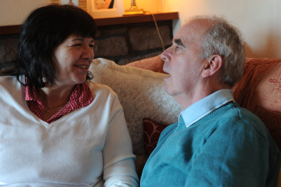 Amanda at home with her husband in 2013.