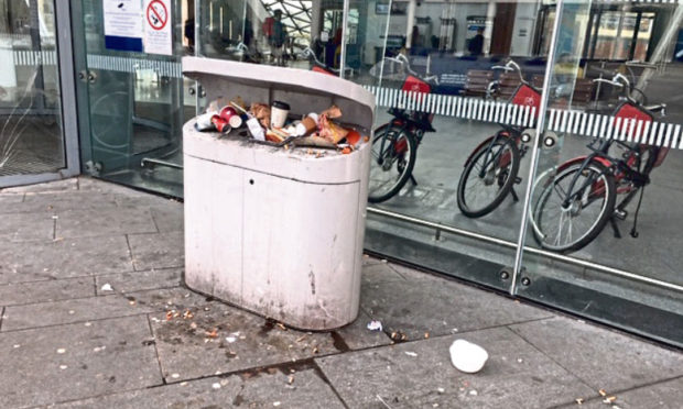 Joyce McIntosh spotted the overflowing bin when boarding a train to Glasgow on Monday.