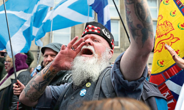 Scottish independence supporters march through Edinburgh during an All Under One Banner march.