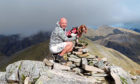 Spaniel Genghis and owner Mac Wright climbed all 282 Munros.