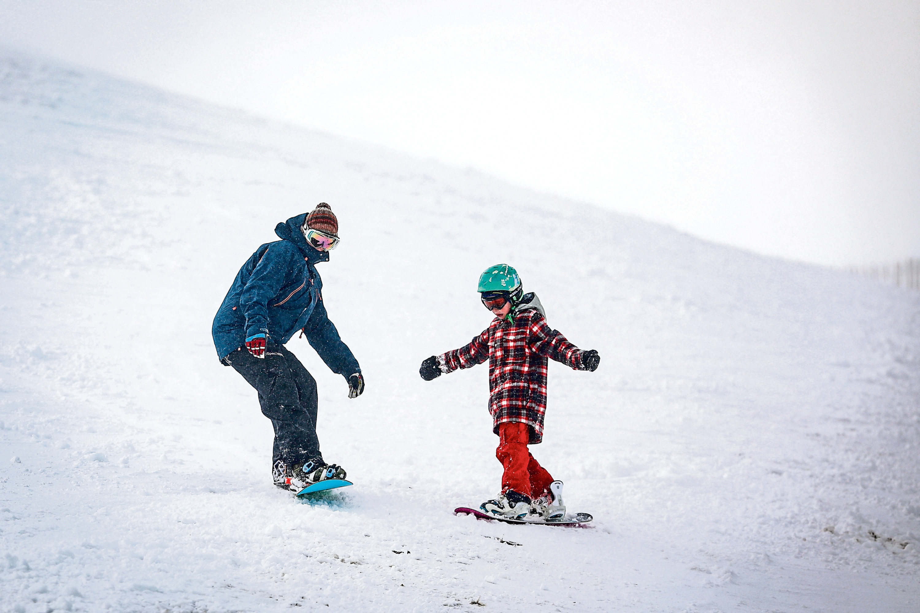 Skiers and snowboarders enjoy the snow at Glenshee in March.