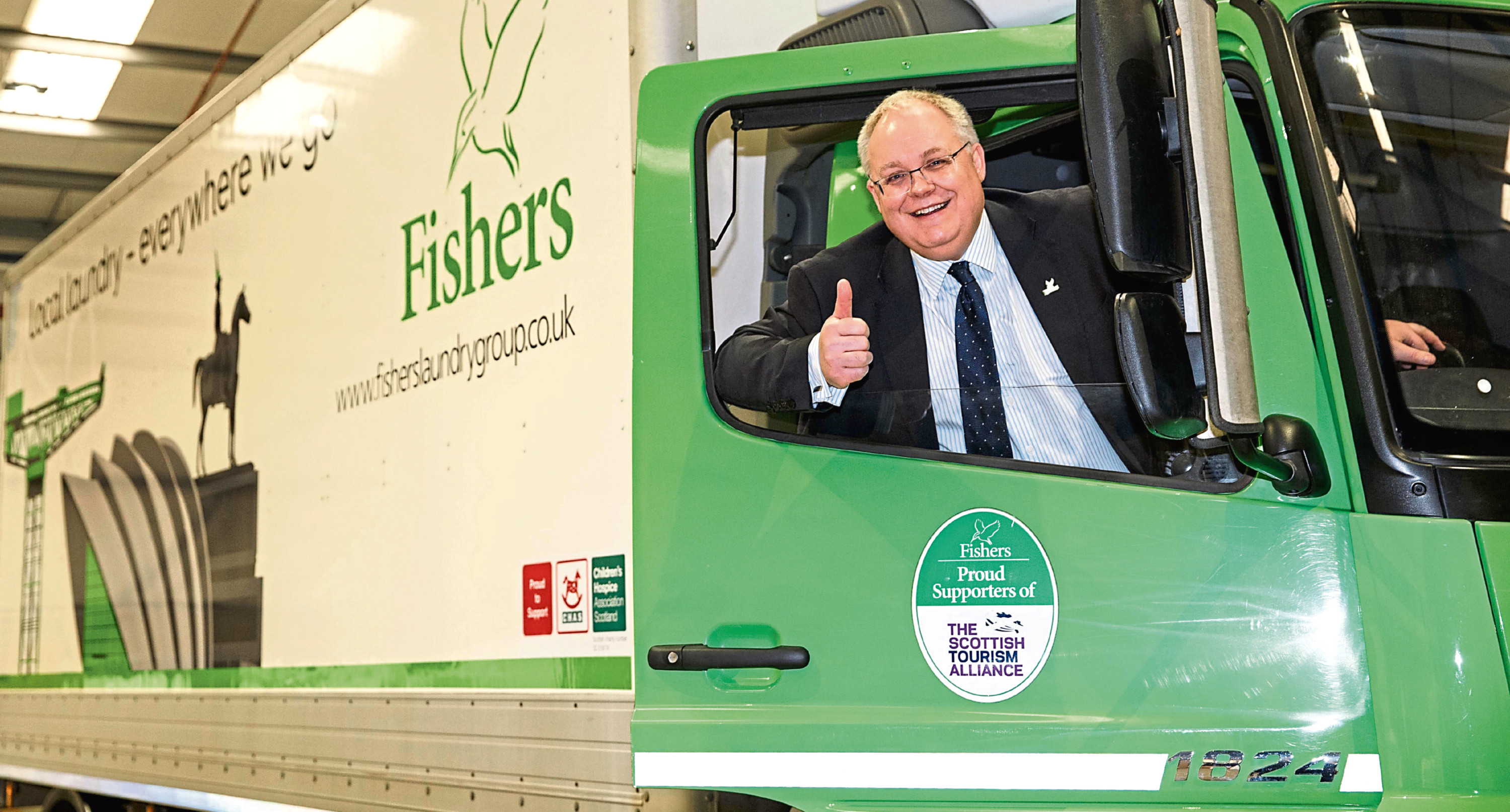 Michael Jones, Fishers MD
Michael Jones MD of Fishers Laundry in the driving seat at the unveiling of new truck livery at super laundry opening in Coatbridge.  Picture Robert Perry 17th March 2016

Please credit photo to Robert Perry

Image is free to use in connection with the promotion of the above company or organisation. 'Permissions for ALL other uses need to be sought and payment make be required.


Note to Editors:  This image is free to be used editorially in the promotion of the above company or organisation.  Without prejudice ALL other licences without prior consent will be deemed a breach of copyright under the 1988. Copyright Design and Patents Act  and will be subject to payment or legal action, where appropriate.
www.robertperry.co.uk
NB -This image is not to be distributed without the prior consent of the copyright holder.
in using this image you agree to abide by terms and conditions as stated in this caption.
All monies payable to Robert Perry

(PLEASE DO NOT REMOVE THIS CAPTION)
This image
