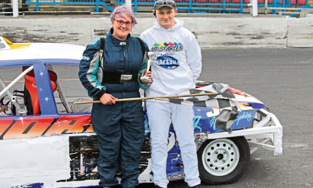 Holly Glen having won a saloon heat and being presented with her trophy by James Simpson.