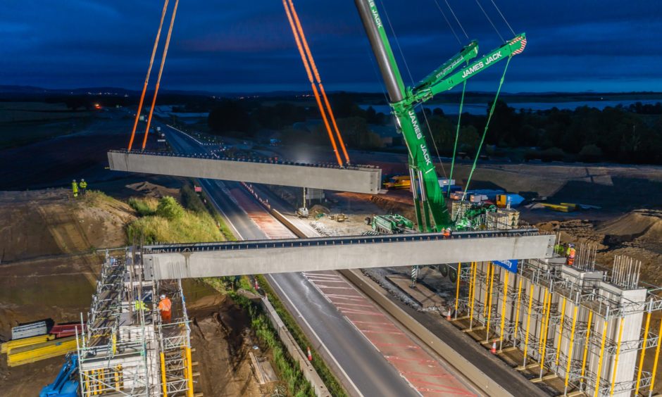 Beams being swung into place over the A9 at Tullybelton.