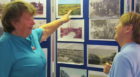 Margaret Copland President and Marianna Buultjens , Vice President, discussing displayed Monifieth pictures.