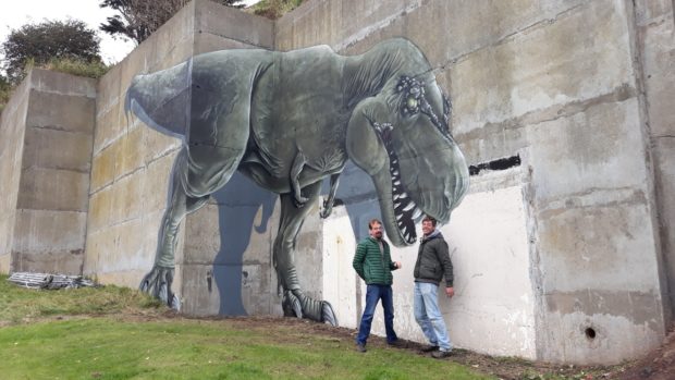 Bob Taylor, chairman of Community-Led Environmental Action for Regeneration, and artist Ian Tayak with the dinosaur art.