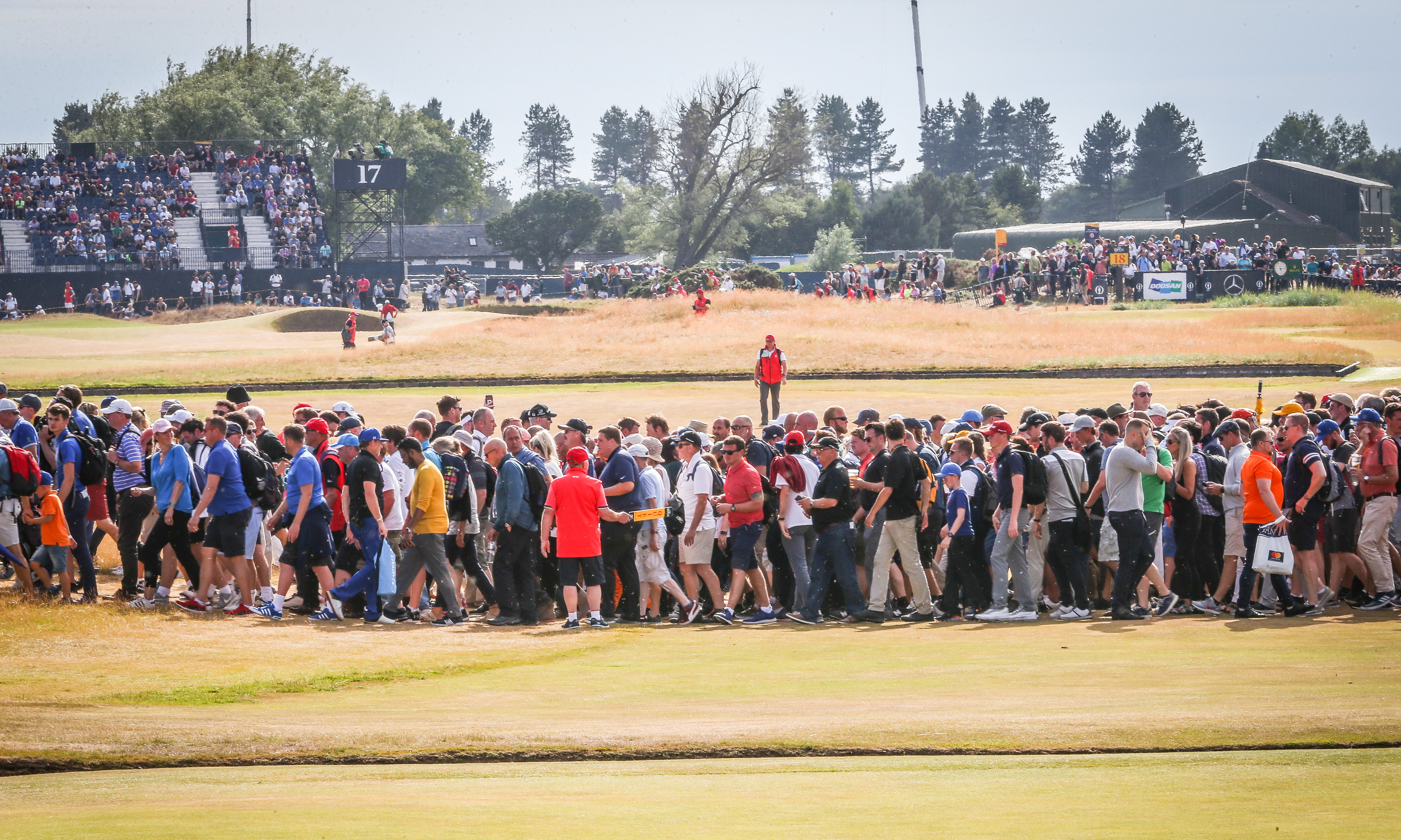 Large crowds lining the fairways to watch players including Tiger Woods. Pic shows large crowds following the big names round Carnoustie Golf Links and watching on the big screen. Saturday, 21st July, 2018.