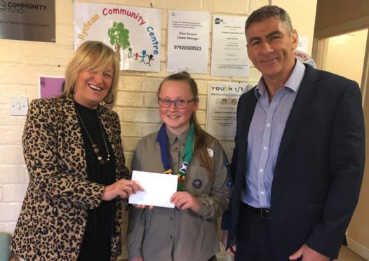 Glenrothes High School pupil Amy Orr with Rose Duncan, Collydean Community Centre manager and Dr Mark Picton, RWE's Markinch biomass plant manager.