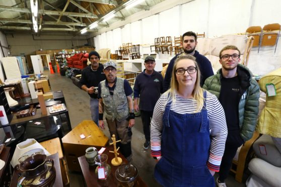 Elaine Duff, manager, at the Furniture Recycling Project Angus, in Arbroathwith volunteers Garry Brown, Martyn MacKinnon, John Mitchell, Ryan Bond and Craig Methven.