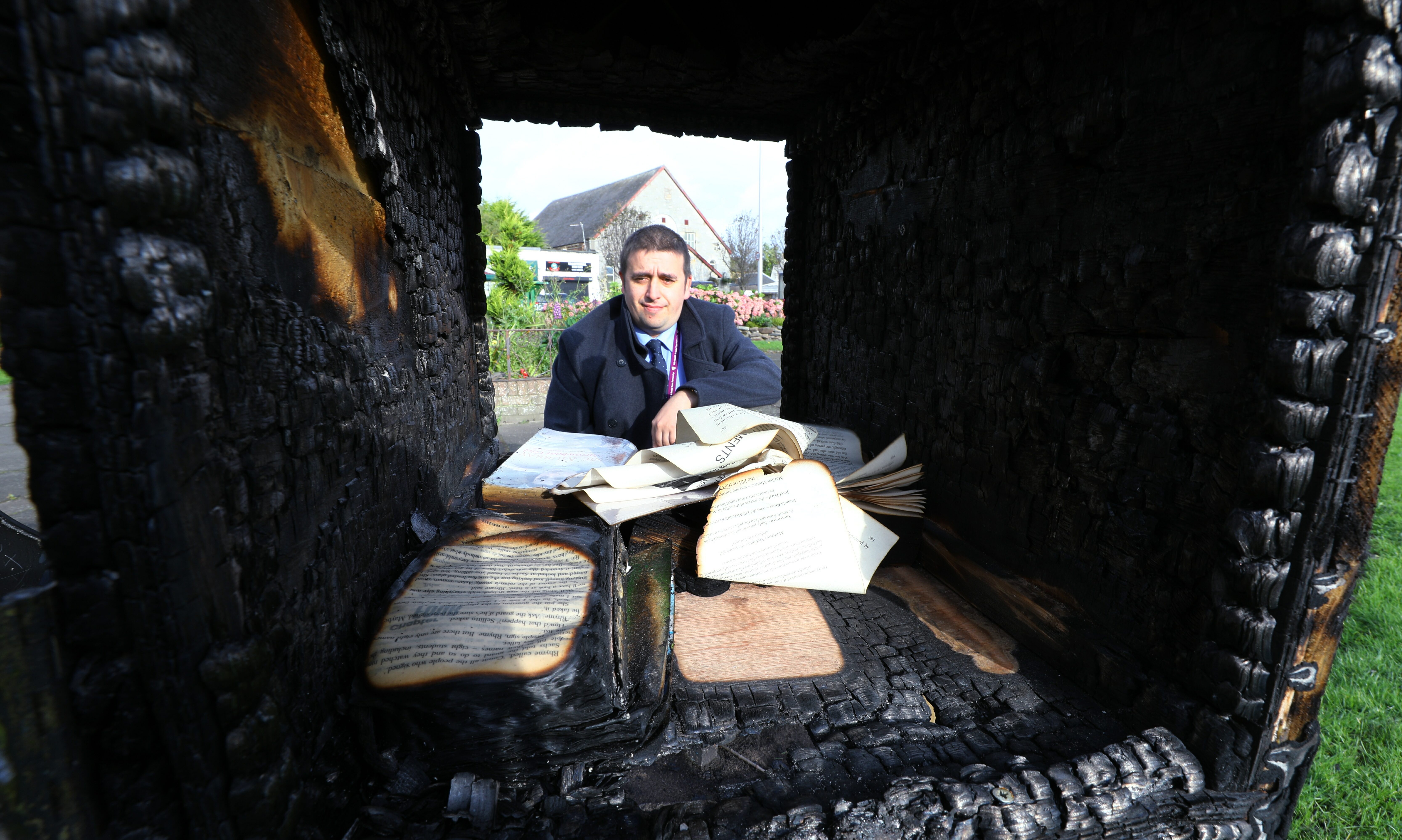 David Graham beside the burnt out 'library' in College Street Gardens in Buckhaven.