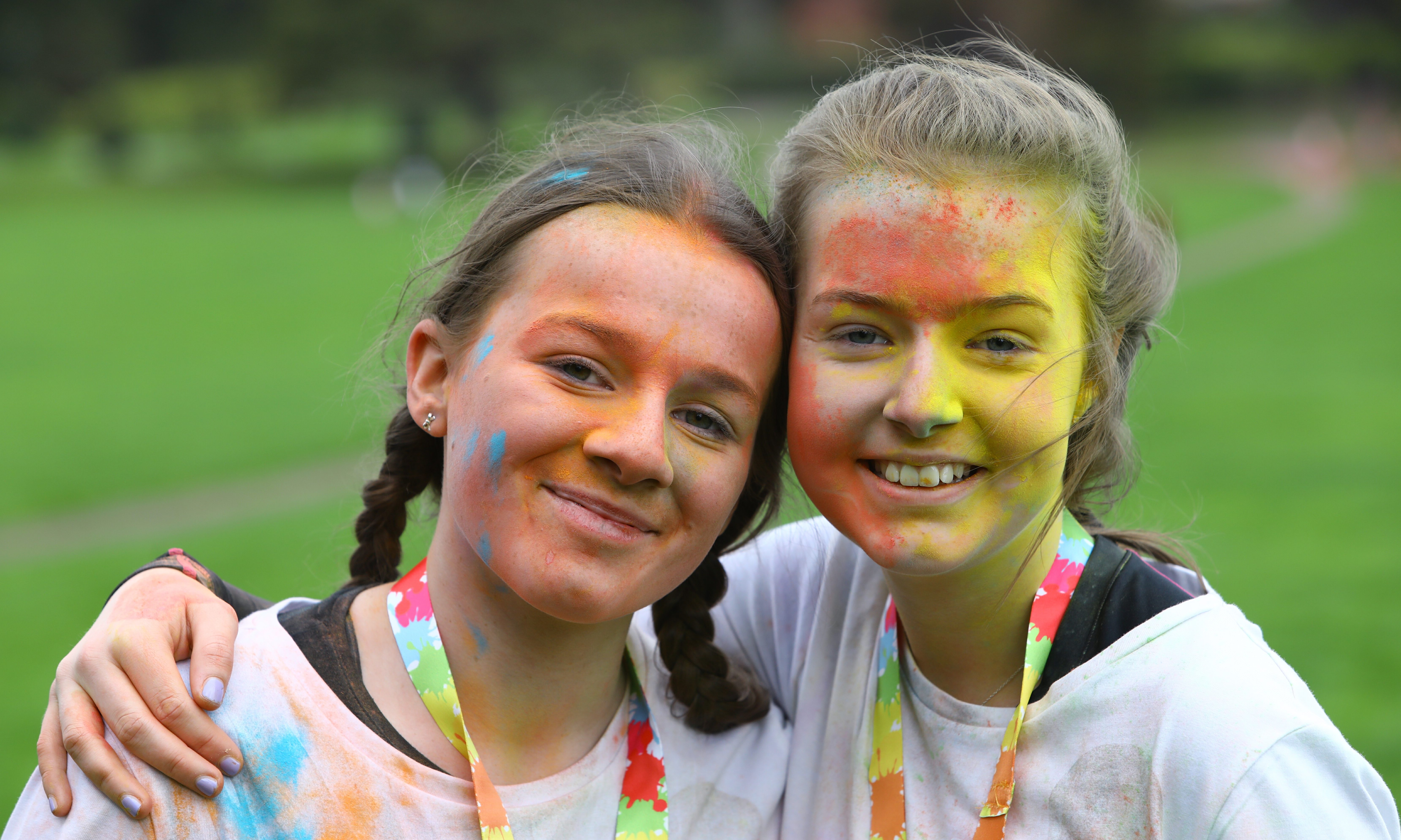 Millie Turnbull, left, age 14, and Lauren Carr, age 13, after finishing the Colourama Run.