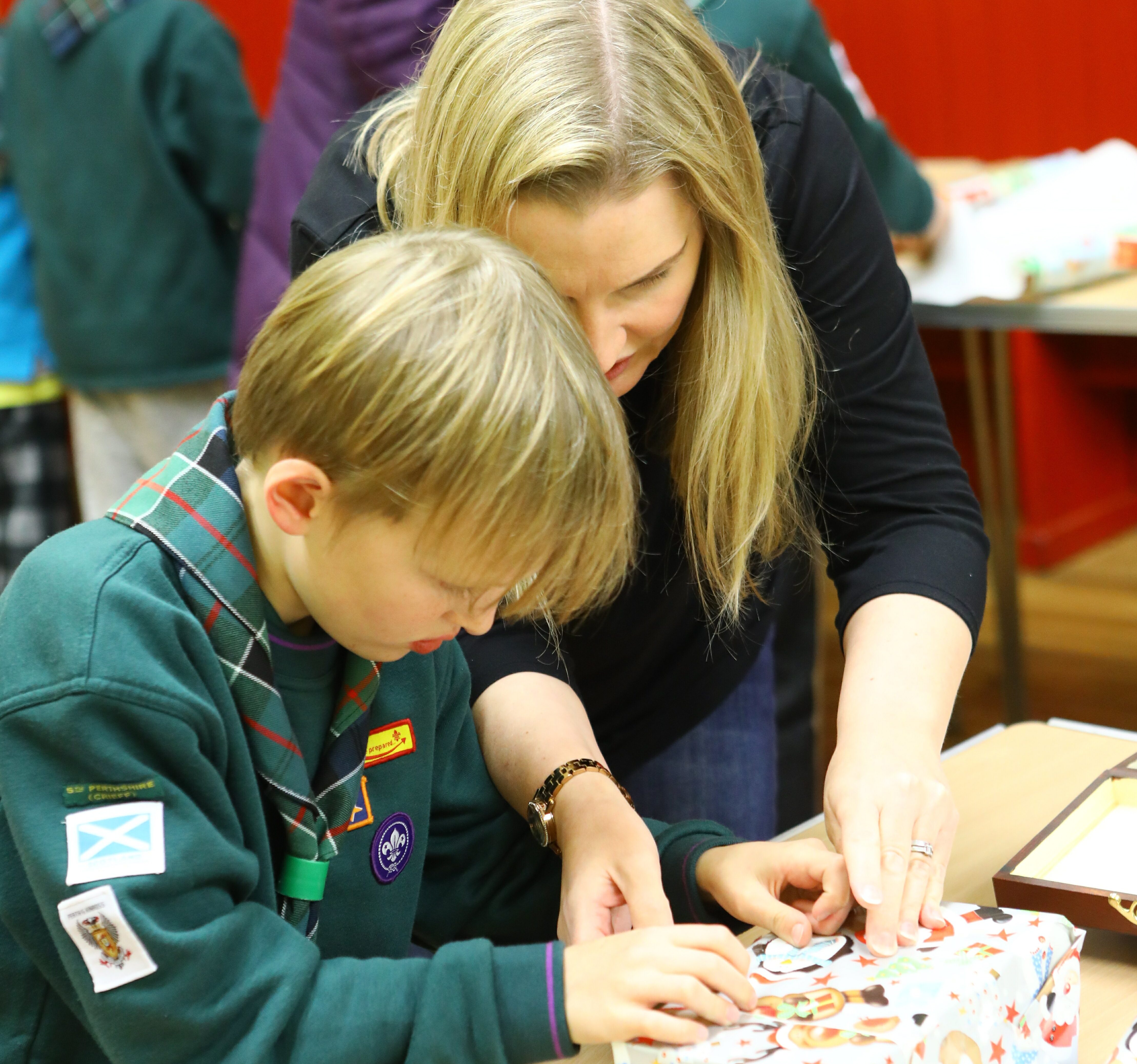 Cub scouts and their parents putting together the morale boxes. Picture: Dougie Nicolson.