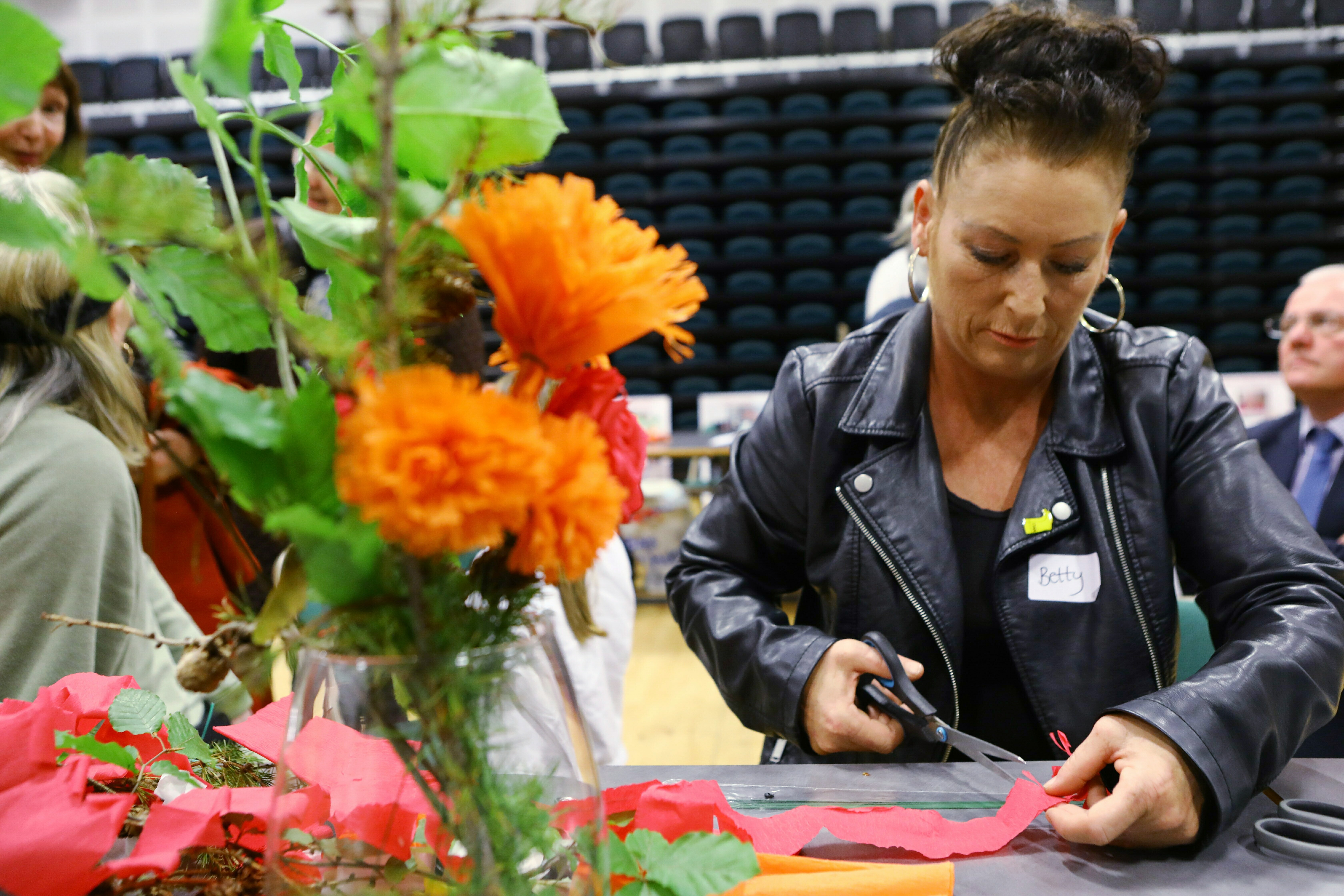 Betty McLaren making hand made flowers, at The Gathering.