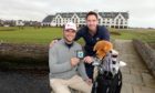 Carnoustie Golf Links chief executive Michael Wells presents Edwards with his engraved bag tag.