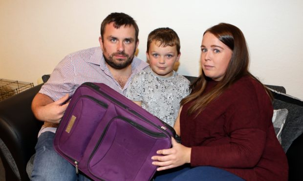 Dad Cameron, 38, Mum Donna Smith, 29, and son Caleb, 7, were 'scammed' out of a caravan holiday at Craig Tara.