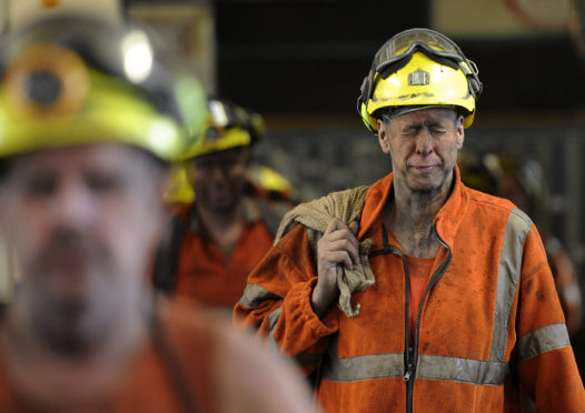 Miners come off the last shift.
