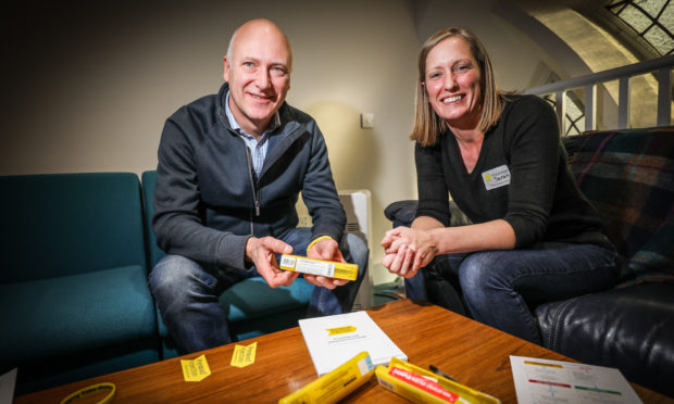 Joe Fitzpatrick MSP and Sarah Donaldson, Specialist Pharmacist discussing Naloxone