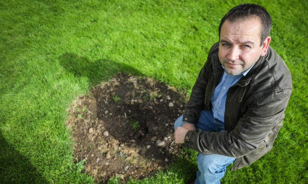 Secretary of Friends of Old St Michael's, Craig Finlay, at the spot the tree was growing.