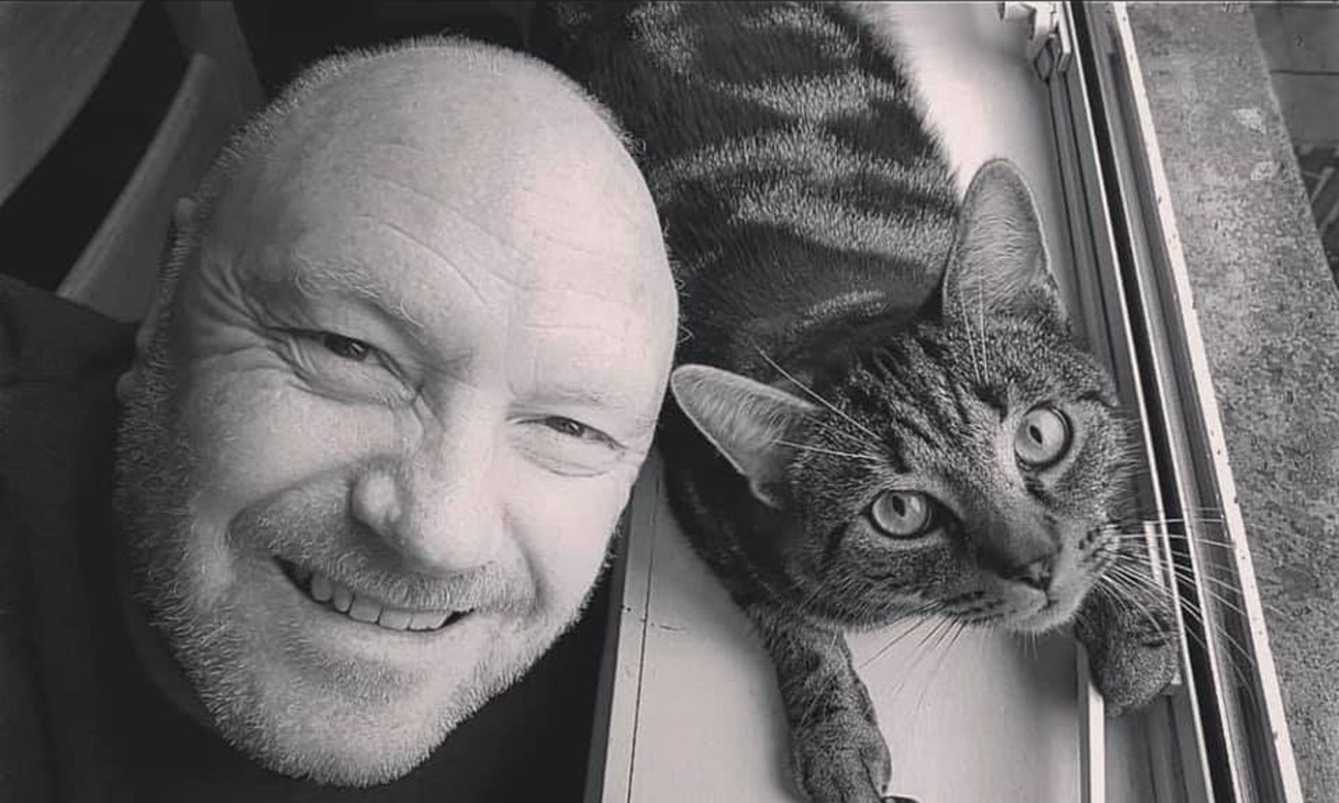 Michael Rooney with his beloved cat Ricky.