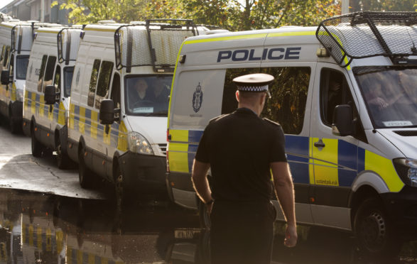 Vans leave from the Scottish Police College at Tulliallan Castle, Kincardine, carrying up to 100 police officers who are being deployed from Scotland to London to assist with policing of the Extinction rebellion climate change protests.