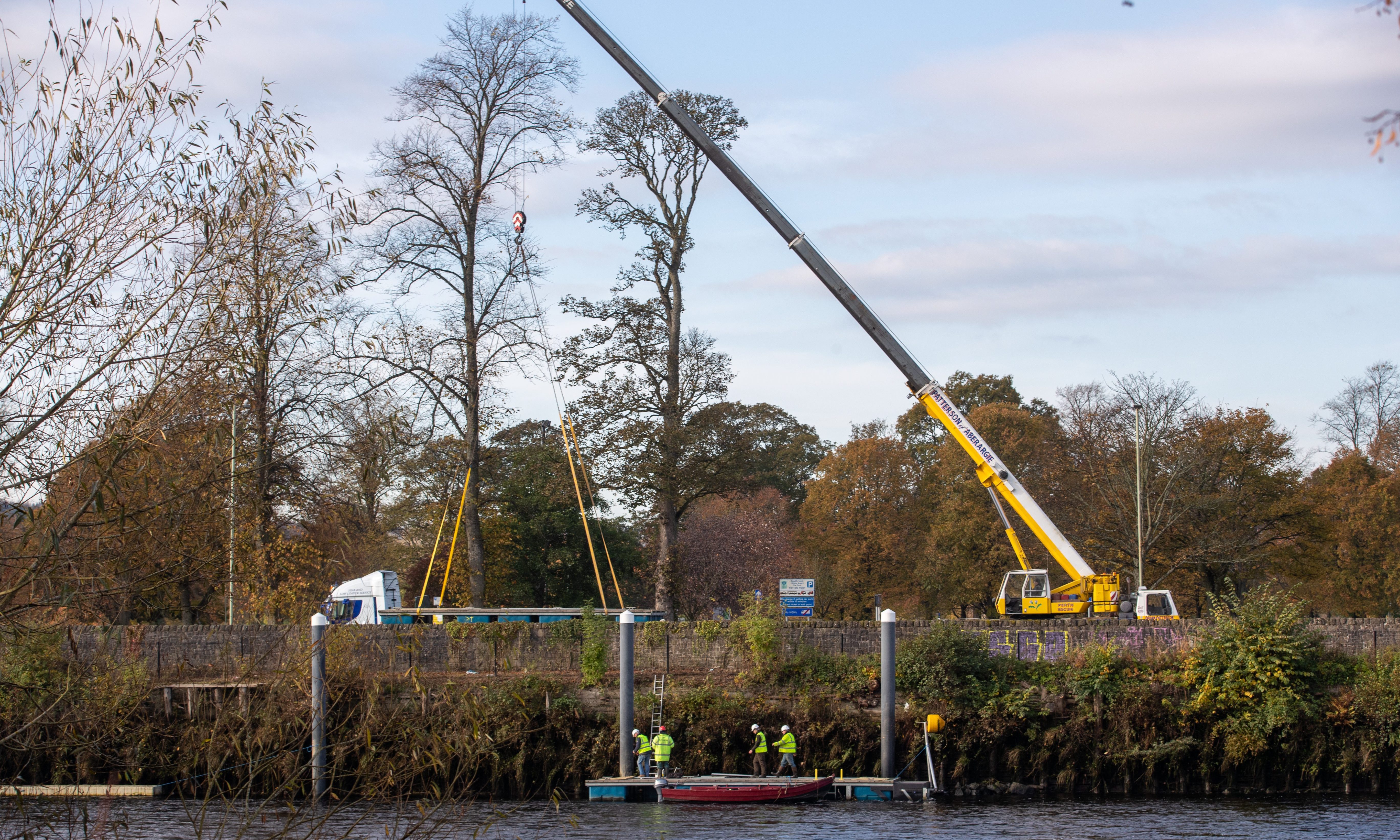 Crews dismantled the walkway at the Fergusson Gallery pontoons on Thursday morning.