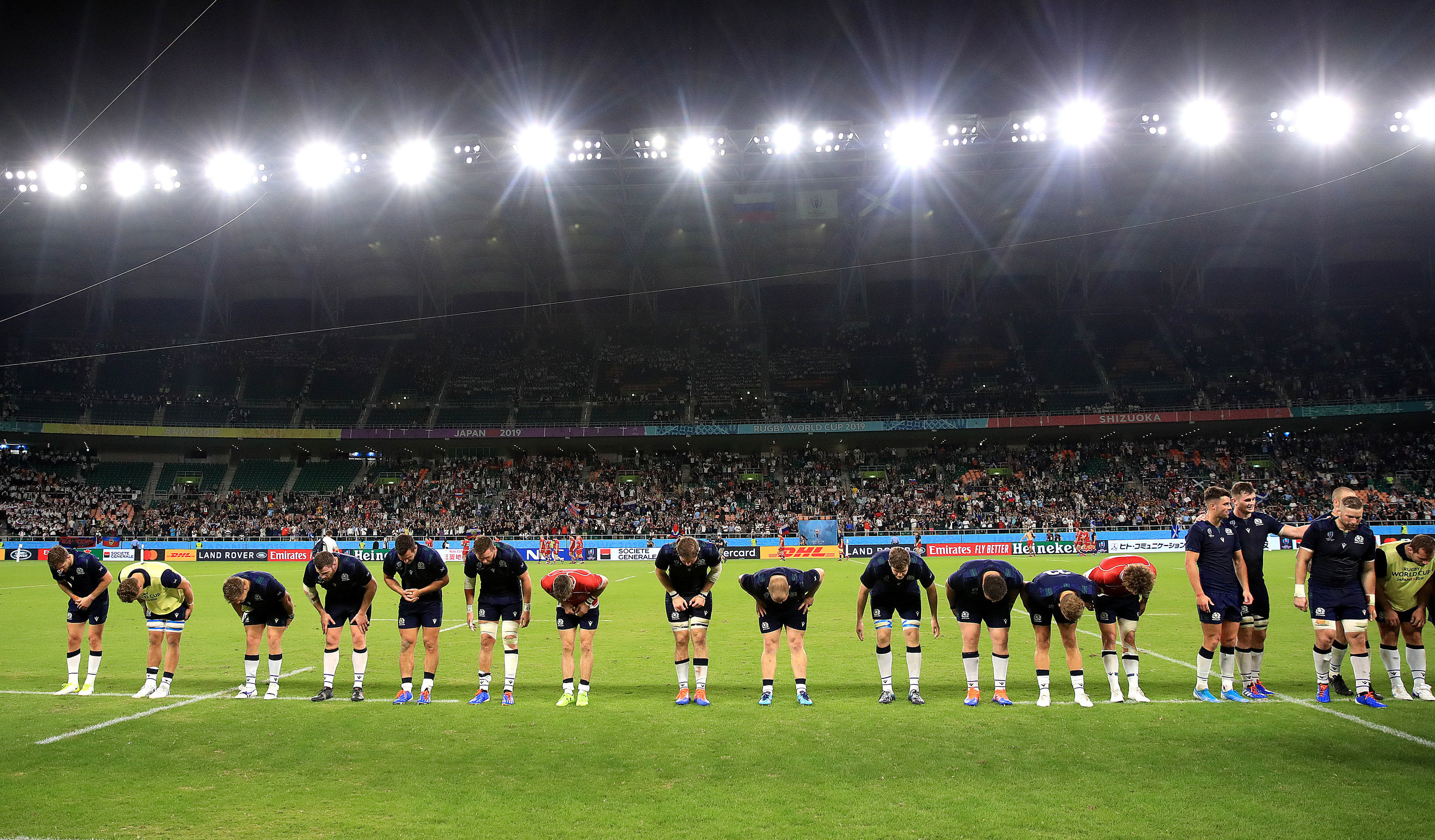 Scotland players bow to fans after the 2019 Rugby World Cup Pool A match at Shizuoka Stadium Ecopa, Shizuoka Prefecture. PA Photo. Picture date: Wednesday October 9, 2019. See PA story RUGBYU Scotland. Photo credit should read: Adam Davy/PA Wire. RESTRICTIONS: Editorial use only. Strictly no commercial use or association. Still image use only. Use implies acceptance of RWC 2019 T&Cs (in particular Section 5 of RWC 2019 T&Cs) at URL: bit.ly/2knOId6