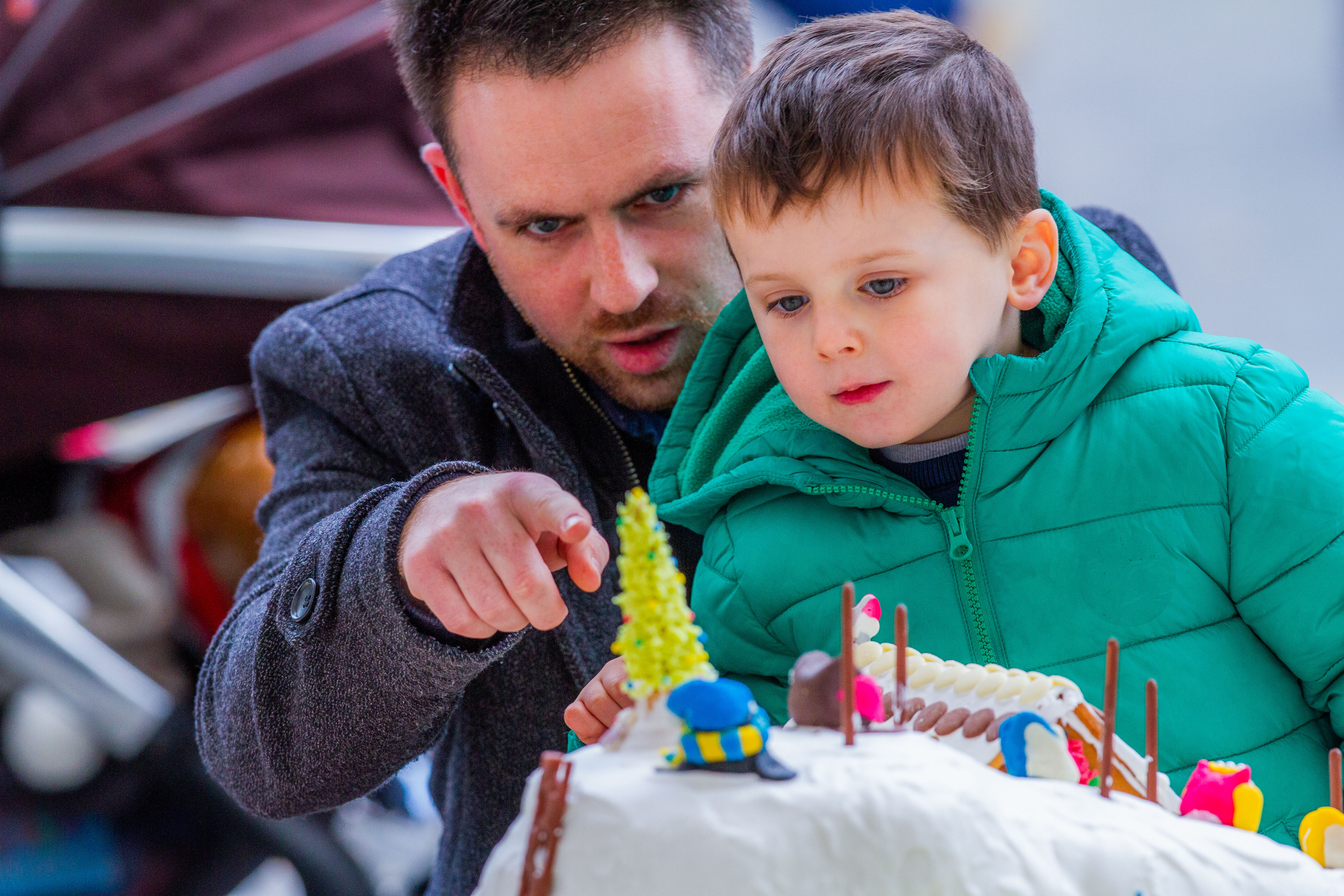 Michael White and son Adam view 2018's cakes.