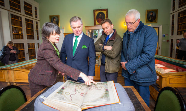 The Tay Cities Deal announcement. L-R: Lara Haggerty (keeper of the books at Innerpeffray Library) alongside MP Colin Clark, Luke Graham MP and local councillor Crawford Reid.