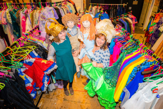 Natalie Offer (left) and Julie Carlin (show off the items for sale.