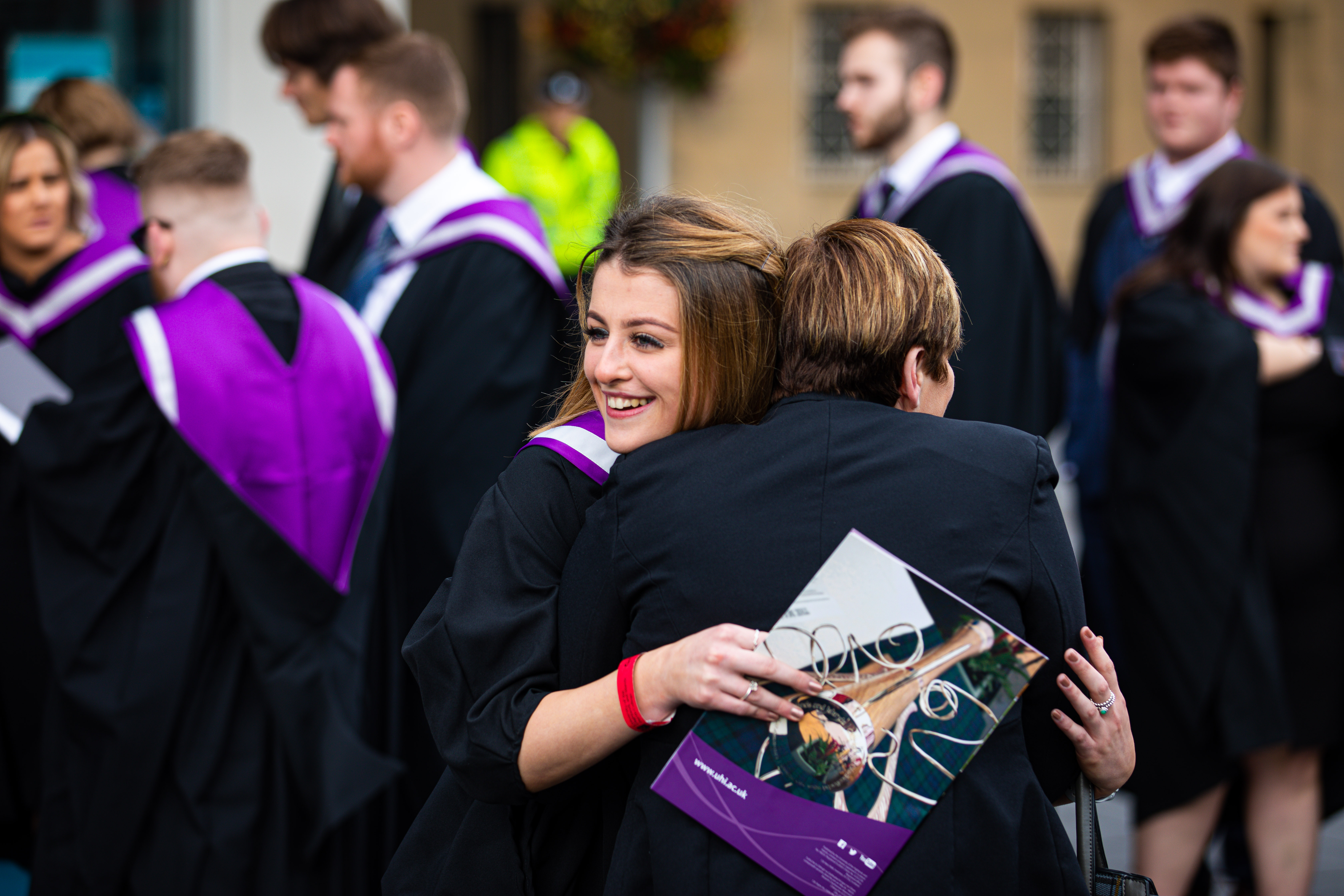 Courier News - Perth - Jamie Buchan - Perth University Graduation Day - CR0014814 - Perth - Picture Shows: Students waiting to be called for Graduation Ceremony at Perth Concert Hall, but there is always time for a cuddle - Thursday 3rd October 2019 - Steve Brown / DCT Media