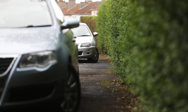 Cars parked on pavements on Ancrum Drive, Dundee. Image: Mhairi Edwards/DC Thomson.