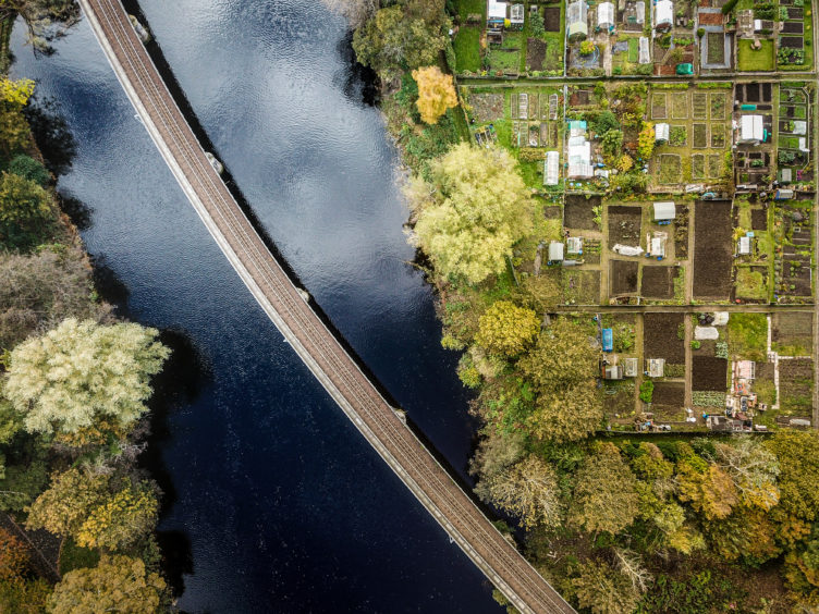 aerial view of River Tay and Moncreiffe island allotments in centre of Perth